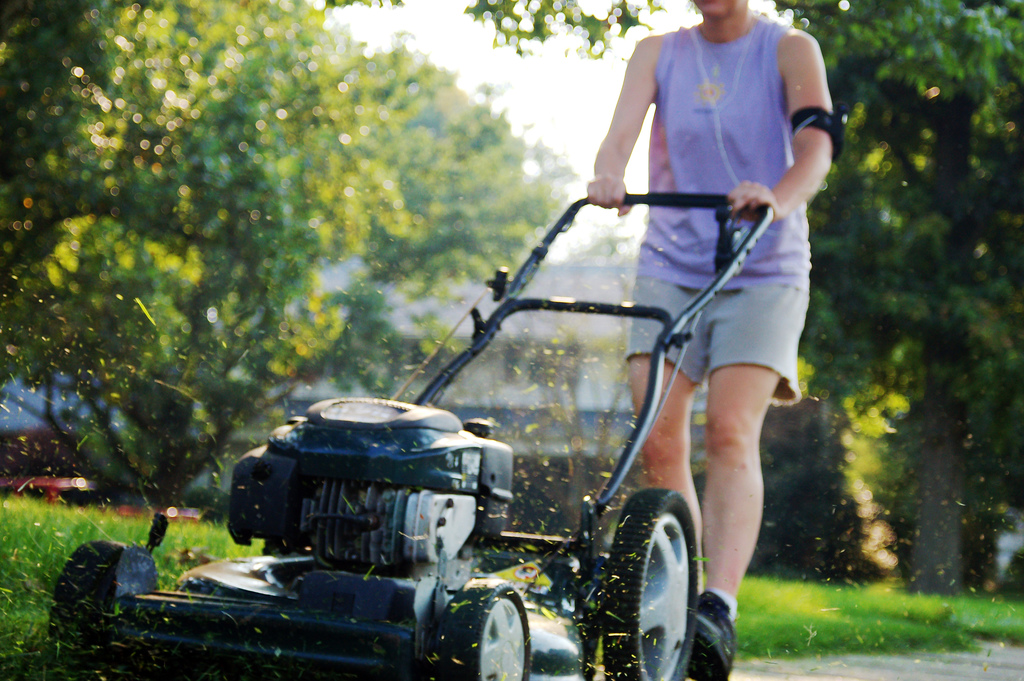 person mowing a lawn