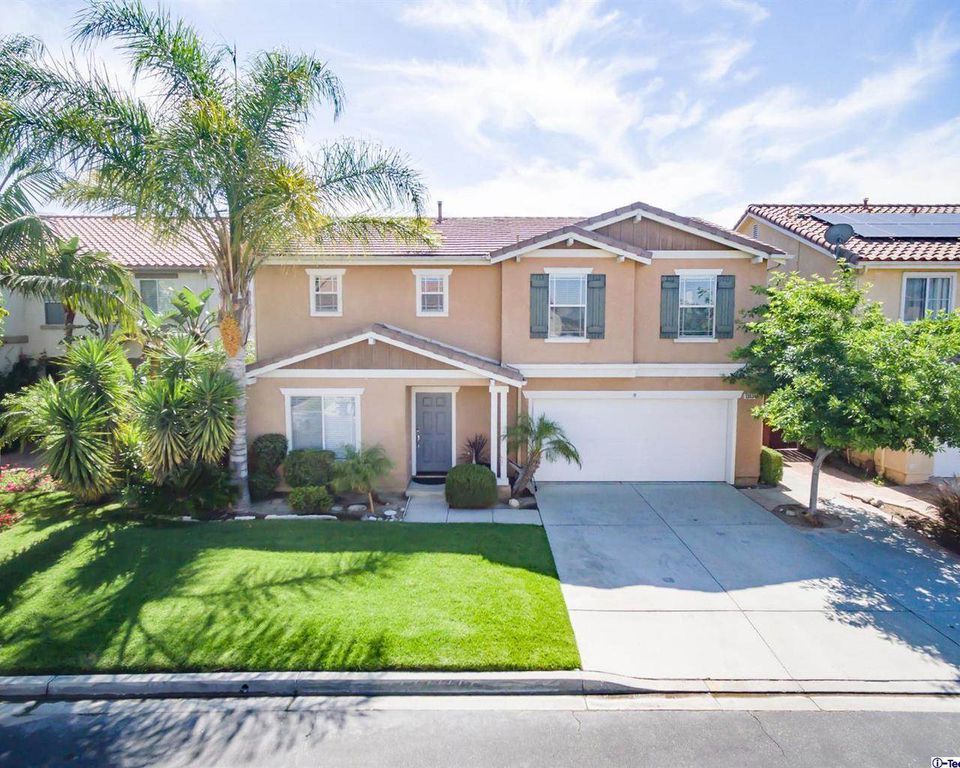 landscaped lawn in front of a house