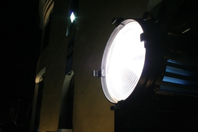 black outdoor spotlight in front of building