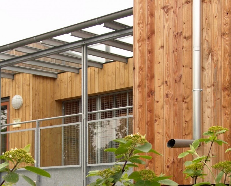 Steel pergola over porch