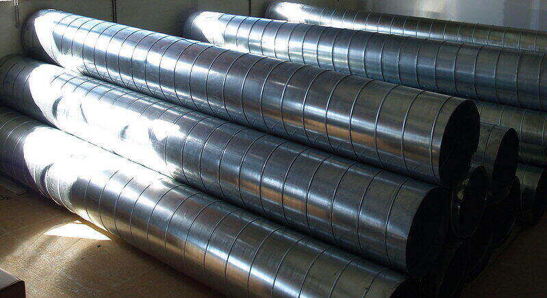 New HVAC ducts sitting in a pile on the floor