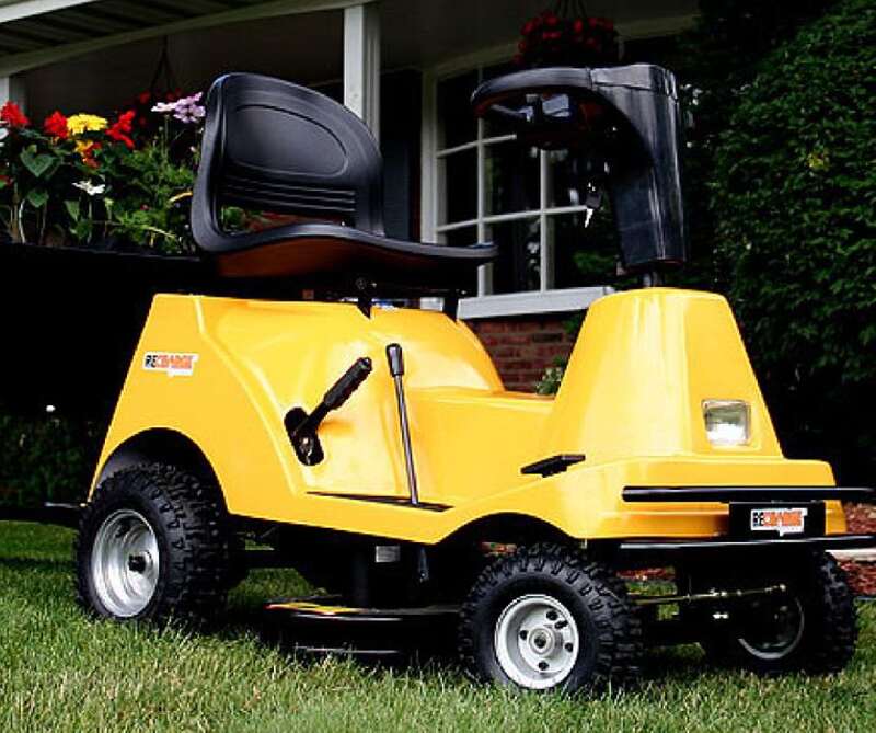electric lawn mower in a lawn