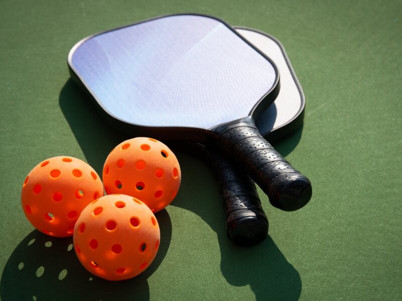 pickleball paddle and balls