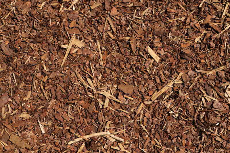 close up image of brown mulch mostly containing wood chips